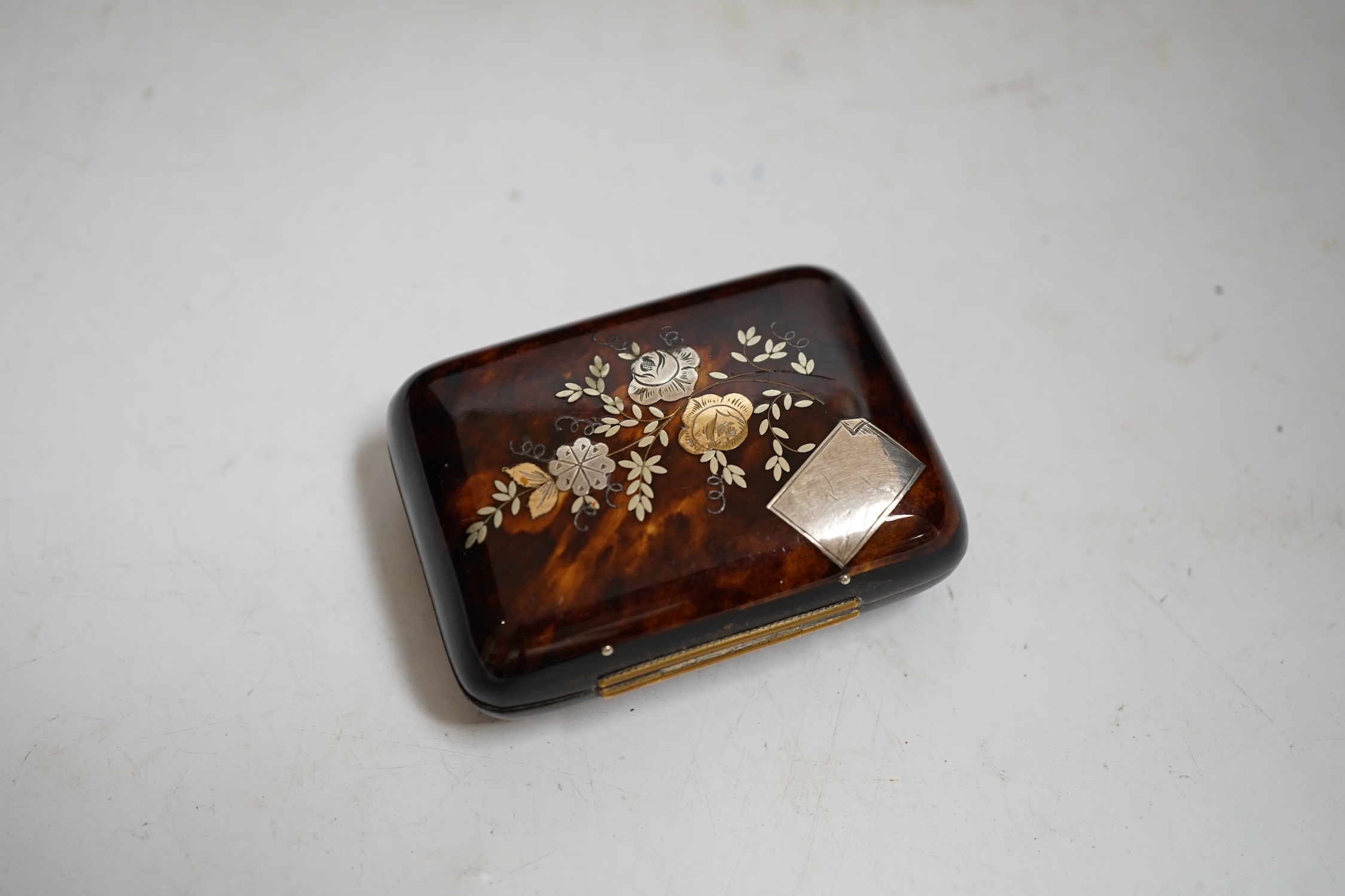A French japanned papier maché glove box together with a tortoiseshell card case inlaid with white and yellow metal, largest 30cm wide. Condition- fair